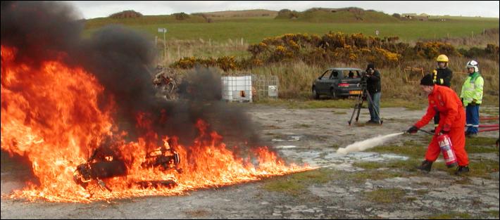 Marshals learning how to put out a Bike fire - supervised by Hogg Motorsport